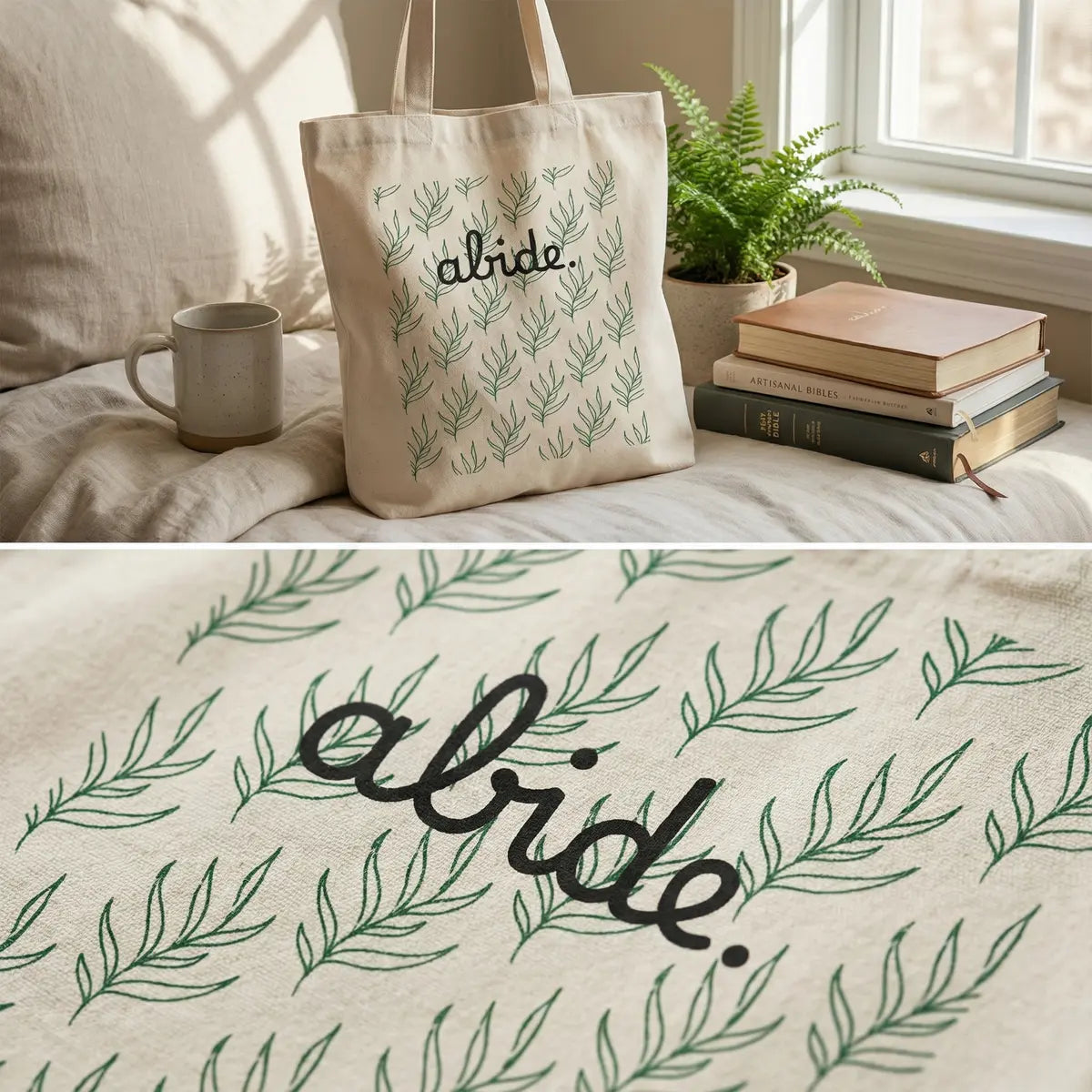 Beige tote bag with 'abide' text and leaf pattern on a bed with books and a mug.