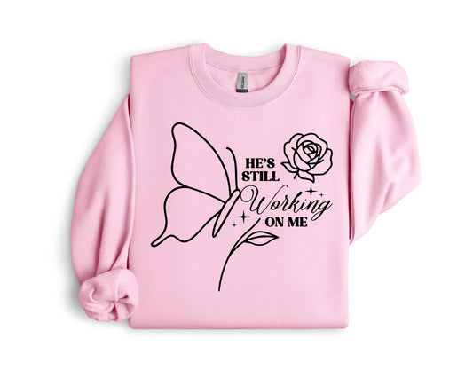Christian Fleece Sweatshirt • He Is Still Working On Me, Faith Apparel